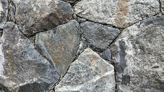 Secrets to creating a beautiful NATURAL STONE WALL Insights from a real stonemason [upl. by Inotna875]